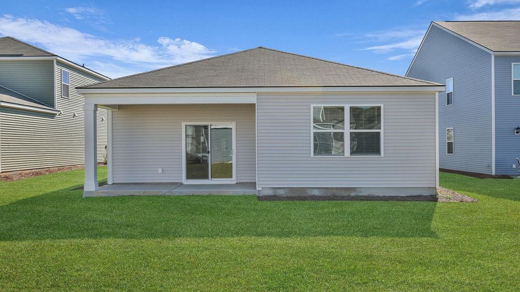 Exterior details and patio area of a home in Pine Hills at Cane Bay, Summerville (Image 22).