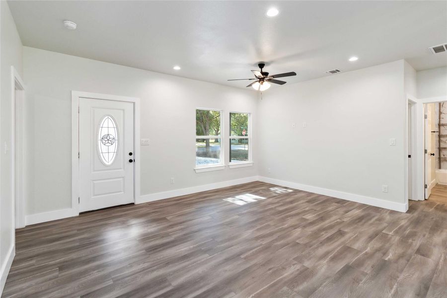 Entryway with recessed lighting, dark wood-type flooring, and a ceiling fan