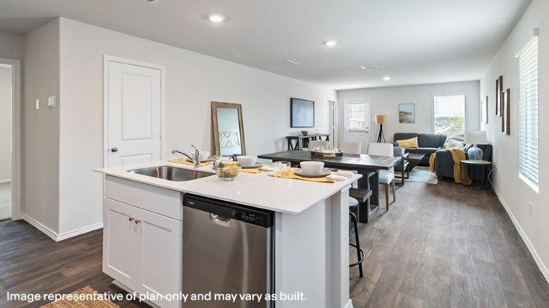 An open-concept living space integrates a well-appointed kitchen island, dining area, and comfortable lounge. An open-concept living space integrates a well-appointed kitchen island, dining area, and comfortable lounge.