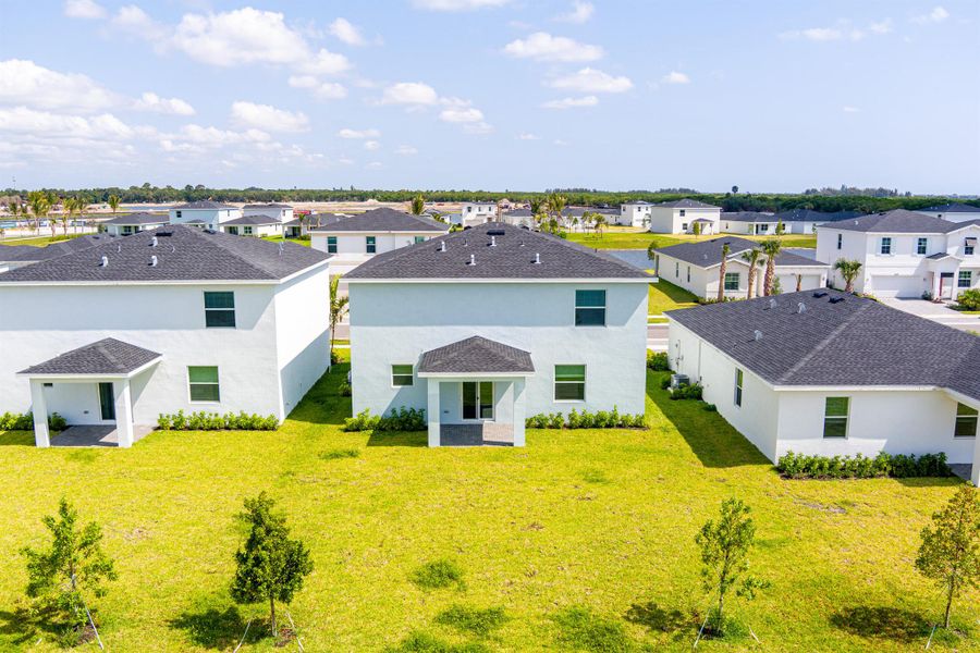 Front exterior of a new home in , Fort Pierce, FL, highlighting curb appeal (Image 1).