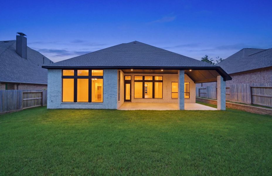 Exterior details and patio area of a home in The Woodlands Hills 65′, Willis (Image 3).
