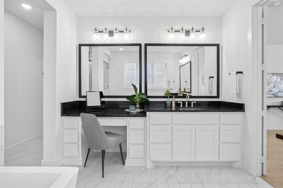 Ensuite bathroom with vanity, light marble finish flooring, and recessed lighting Ensuite bathroom with vanity, light marble finish flooring, and recessed lighting