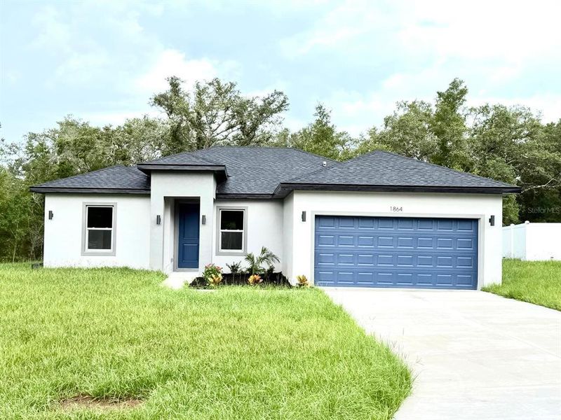 Front exterior of a new home in , Citrus Springs, FL, highlighting curb appeal (Image 1). Front exterior of a new home in , Citrus Springs, FL, highlighting curb appeal (Image 1).