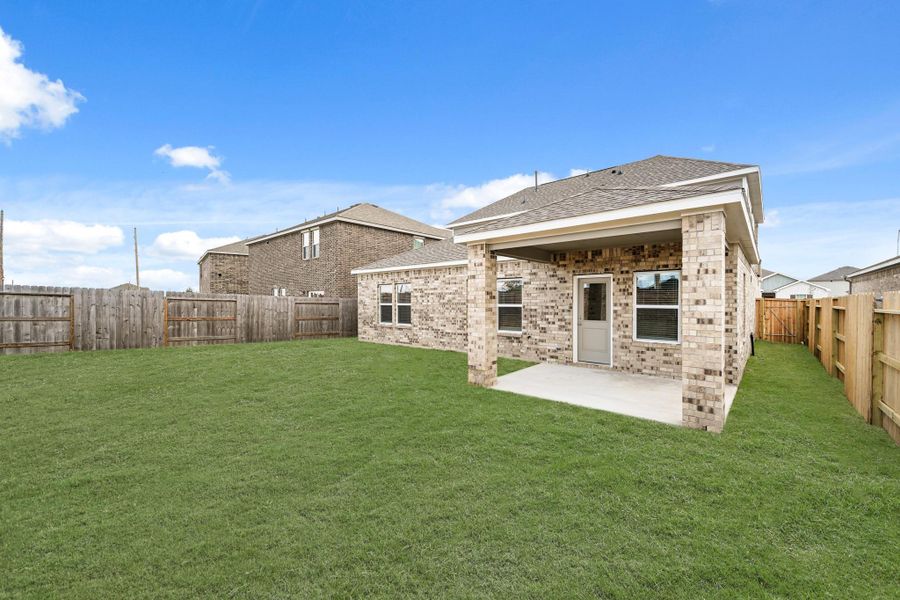 Exterior details and patio area of a home in Sunterra, Katy (Image 4).