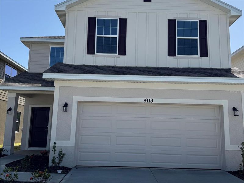 Front exterior of a new home in Harmony Central, Harmony, FL, highlighting curb appeal (Image 19). Front exterior of a new home in Harmony Central, Harmony, FL, highlighting curb appeal (Image 19).