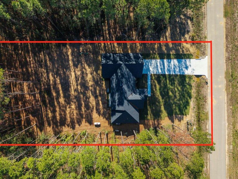 Long driveway entrance to a home sitting on nearly an acre!