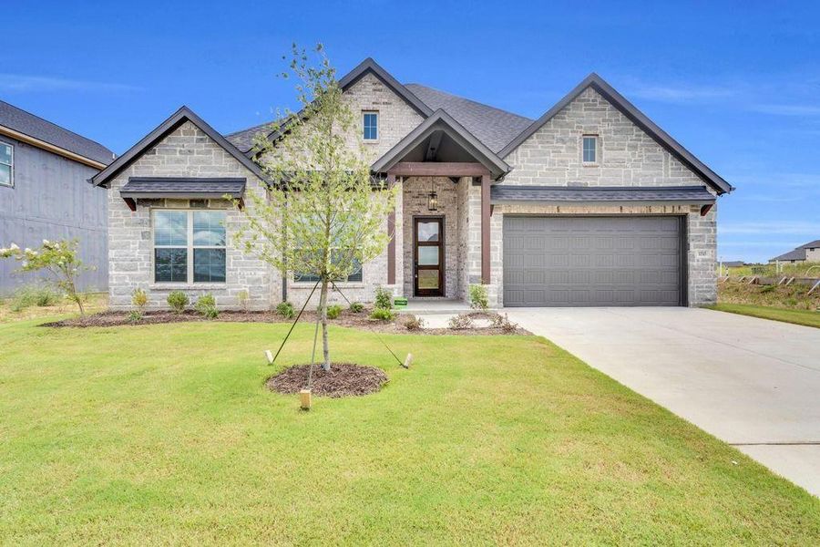 Front exterior of a new home in , Venus, TX, highlighting curb appeal (Image 22).