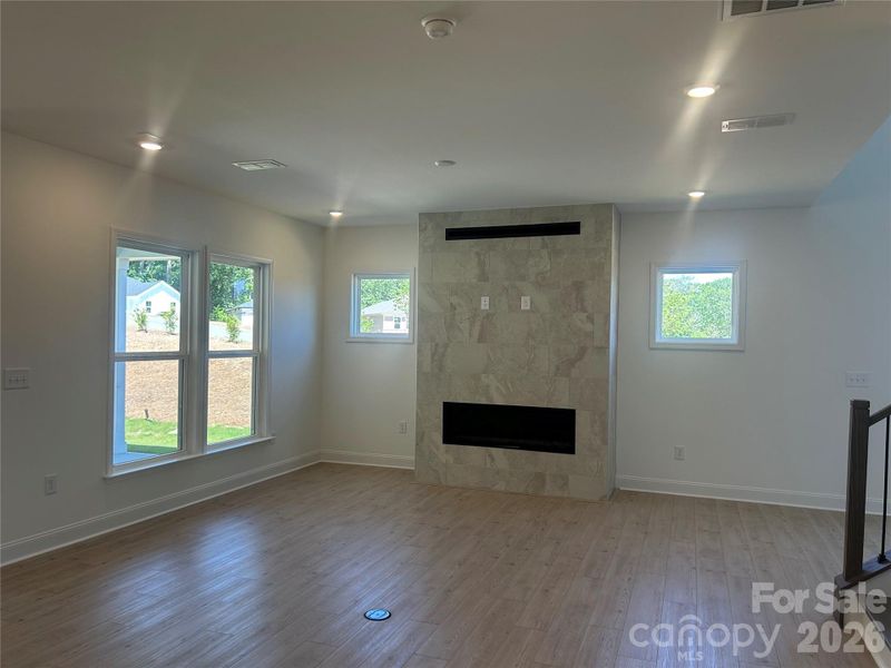 Spacious Gathering Room with Modern Tile Fireplace