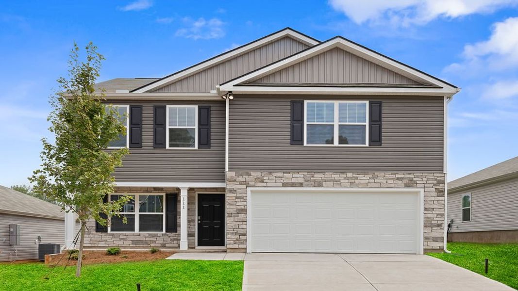 Front exterior of a new home in Treemont Commons, Wellford, SC, highlighting curb appeal (Image 1). Front exterior of a new home in Treemont Commons, Wellford, SC, highlighting curb appeal (Image 1).