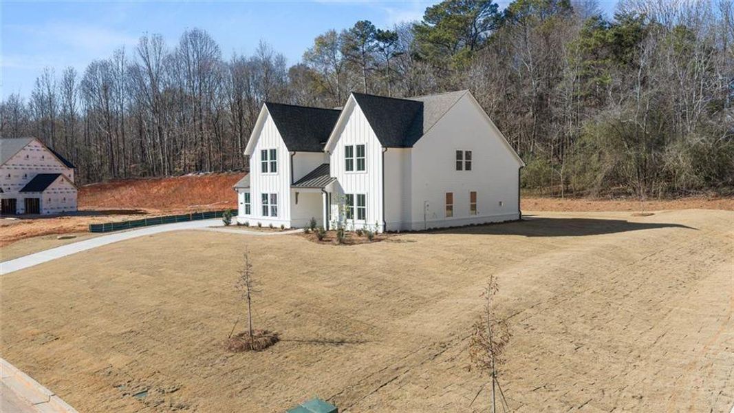 Front exterior of a new home in , Gainesville, GA, highlighting curb appeal (Image 28). Front exterior of a new home in , Gainesville, GA, highlighting curb appeal (Image 28).