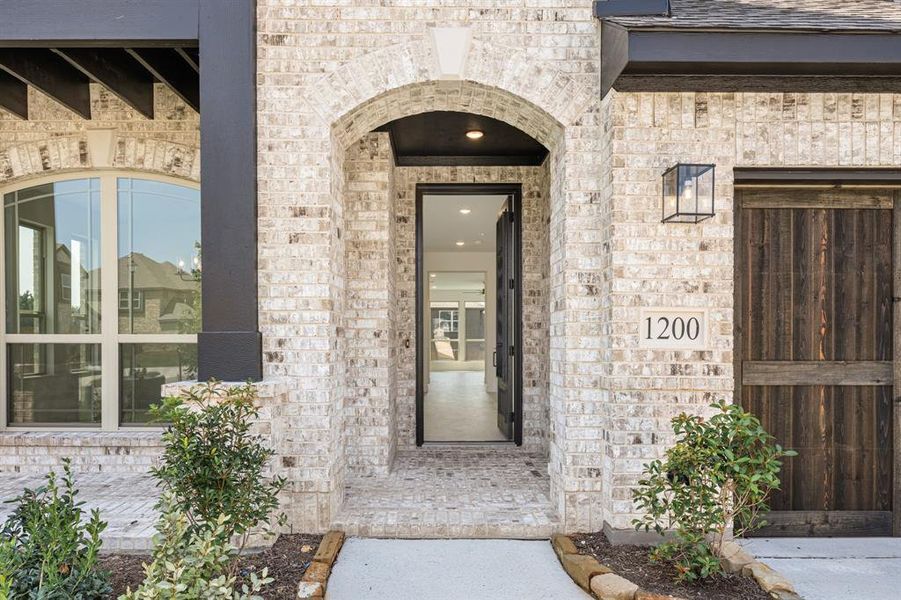 Front exterior of a new home in Trees Farm, DeSoto, TX, highlighting curb appeal (Image 26). Front exterior of a new home in Trees Farm, DeSoto, TX, highlighting curb appeal (Image 26).