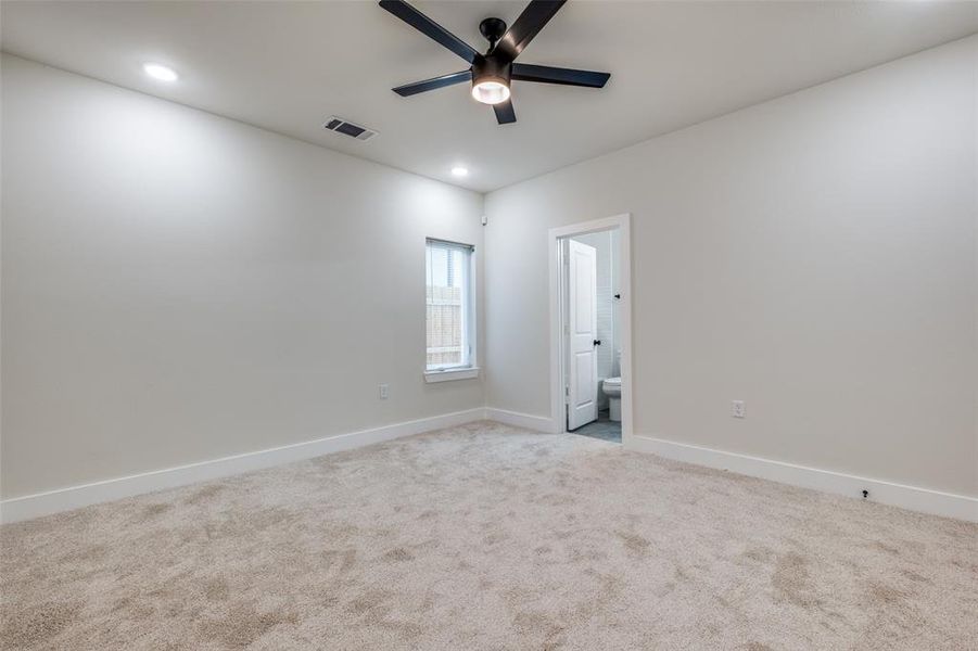 Spare room featuring carpet floors, recessed lighting, and a ceiling fan Spare room featuring carpet floors, recessed lighting, and a ceiling fan