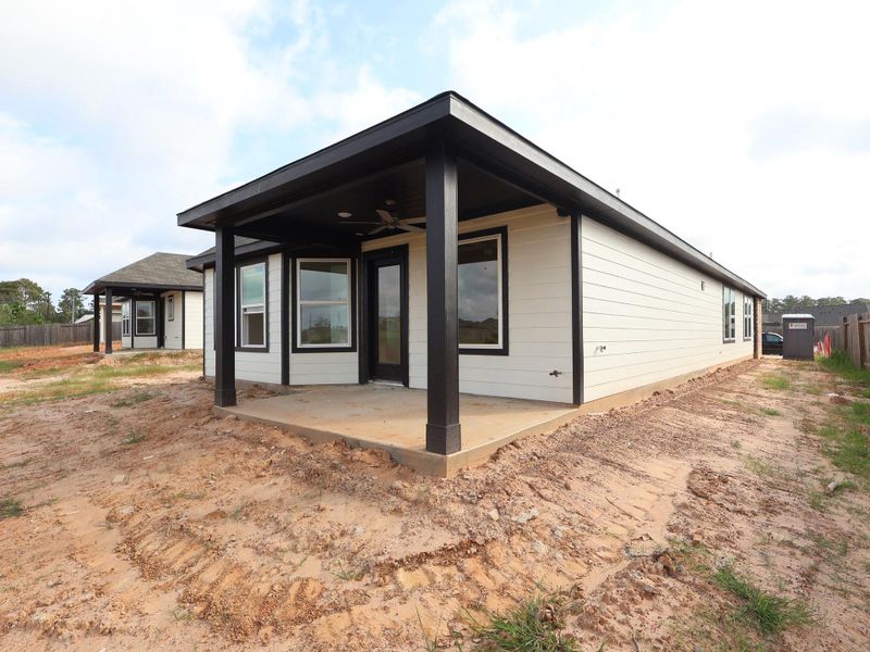 Front exterior of a new home in Magnolia Ridge, Magnolia, TX, highlighting curb appeal (Image 2). Front exterior of a new home in Magnolia Ridge, Magnolia, TX, highlighting curb appeal (Image 2).