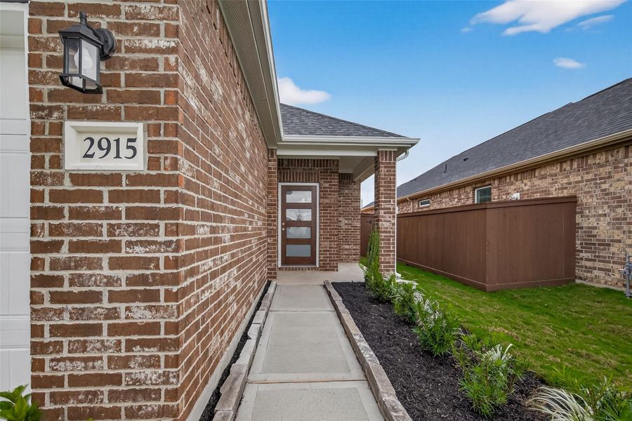 Exterior details and patio area of a home in Rates starting as low as, Iowa Colony (Image 4).