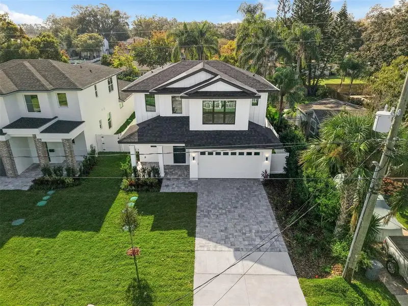 Front exterior of a new home in , Orlando, FL, highlighting curb appeal (Image 27).