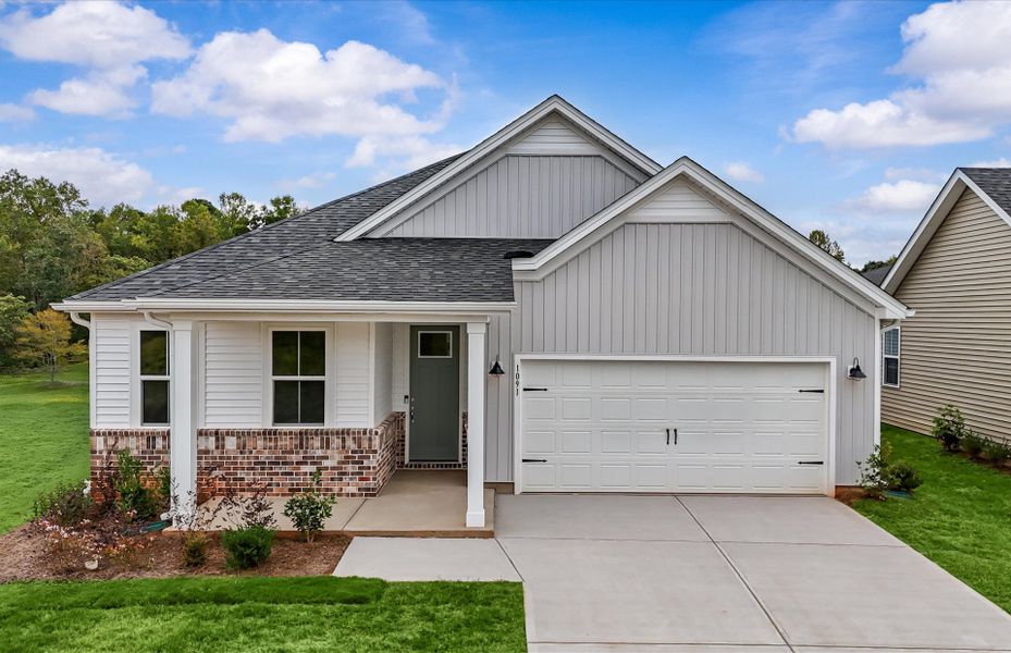 Front exterior of a new home in Sweetwater Hills, Moore, SC, highlighting curb appeal (Image 2). Front exterior of a new home in Sweetwater Hills, Moore, SC, highlighting curb appeal (Image 2).