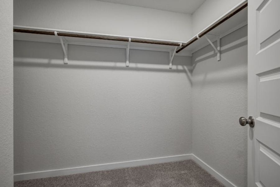 A white wall with a metal railing. A white wall with a metal railing.