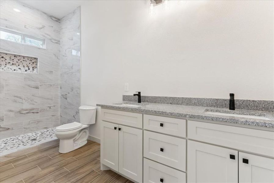 Bathroom featuring vanity and toilet