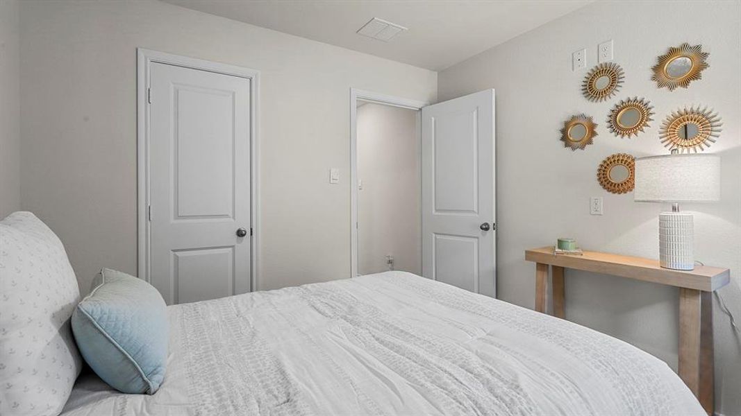 This room features light-colored walls and white paneled doors