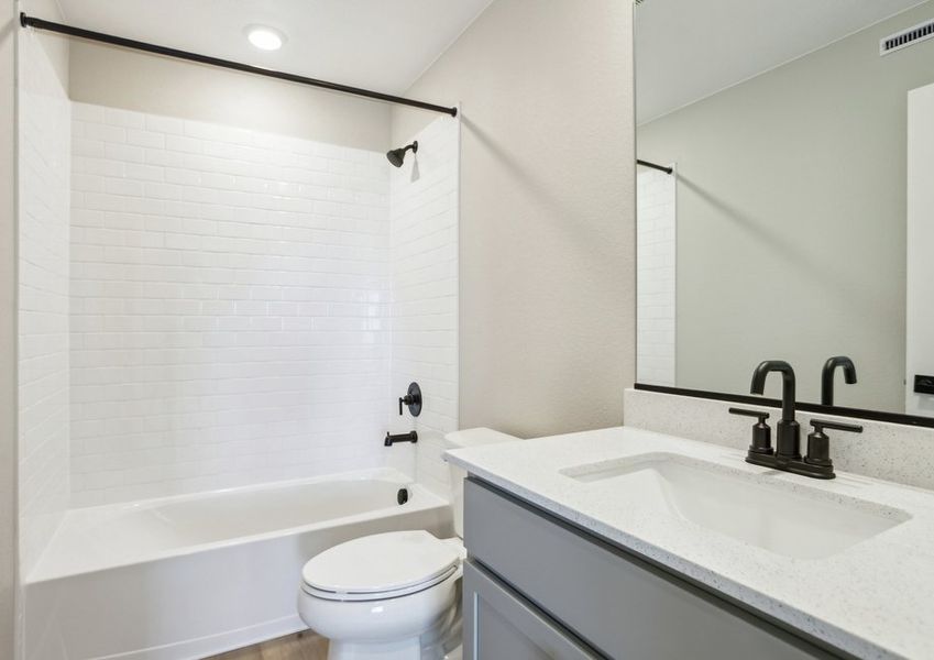 The secondary bathroom has a tub/shower combo.