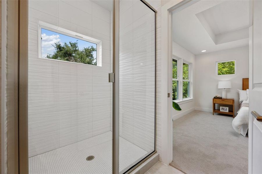 Step into the spacious stand-alone shower that creates a tranquil oasis.