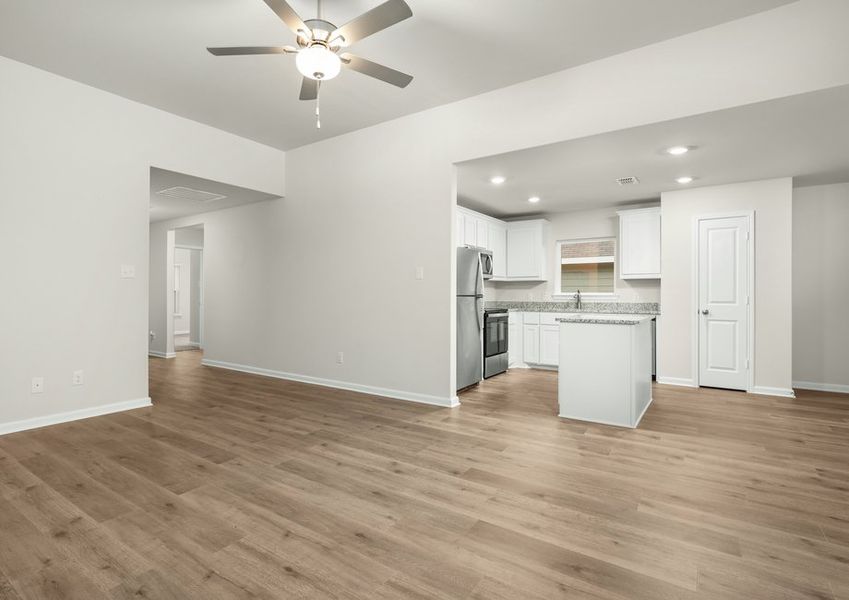 The kitchen sits right off of the family room. The kitchen sits right off of the family room.