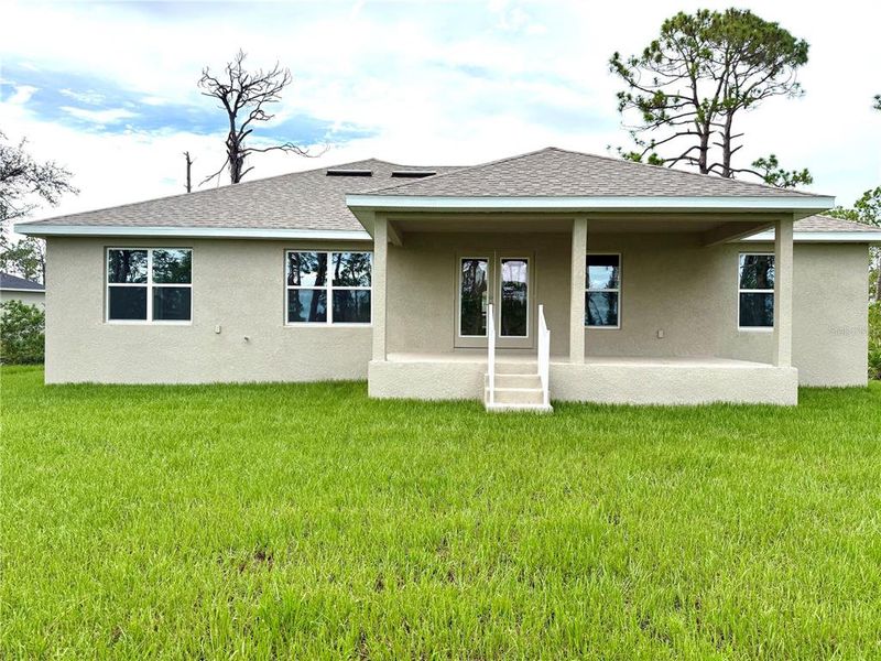 Front exterior of a new home in Rotonda, Rotonda West, FL, highlighting curb appeal (Image 2).