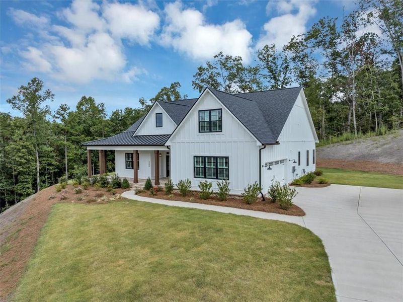 Front exterior of a new home in , Ball Ground, GA, highlighting curb appeal (Image 2).