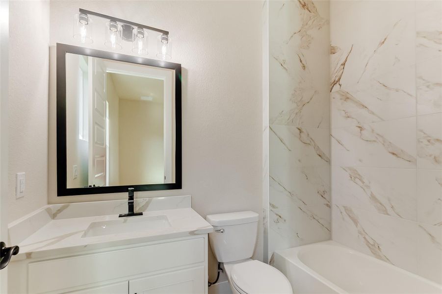 Bathroom featuring vanity and bathing tub / shower combination Bathroom featuring vanity and bathing tub / shower combination