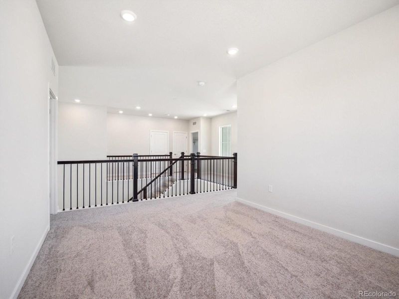 Spacious, unfurnished interior of a new home in Trails at Smoky Hill, Parker (Image 14).