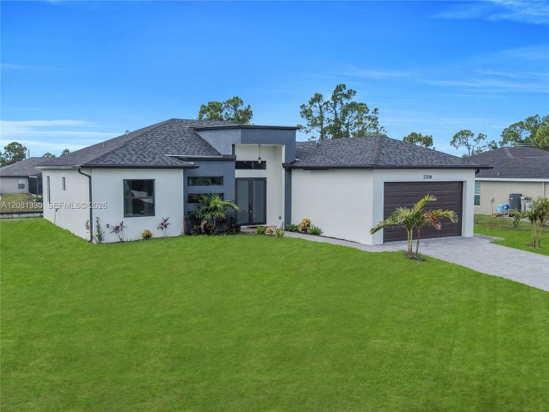 Front exterior of a new home in , Cape Coral, FL, highlighting curb appeal (Image 27). Front exterior of a new home in , Cape Coral, FL, highlighting curb appeal (Image 27).
