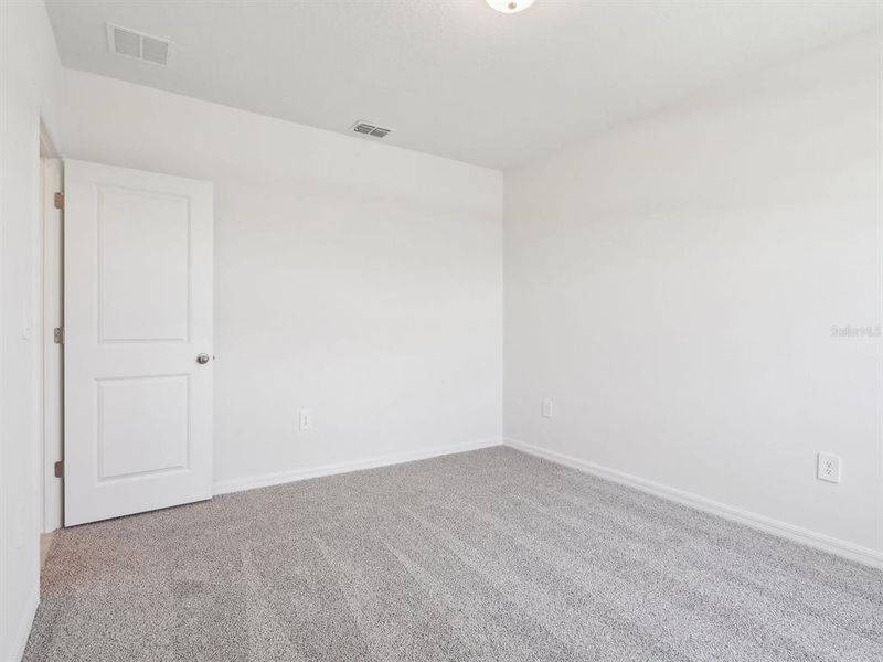 Spacious, unfurnished interior of a new home in The Reserve at Van Oaks, Auburndale (Image 28).