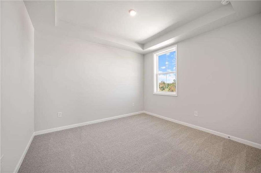 Spacious, unfurnished interior of a new home in The Paddocks at Doc Hughes, Buford (Image 26).