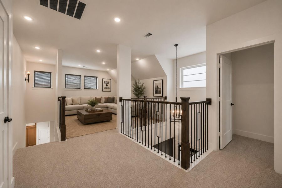 UPSTAIRS YOU'LL FIND AN OPEN LOFT SPACE THAT MAKES A PERFECT GAME ROOM!