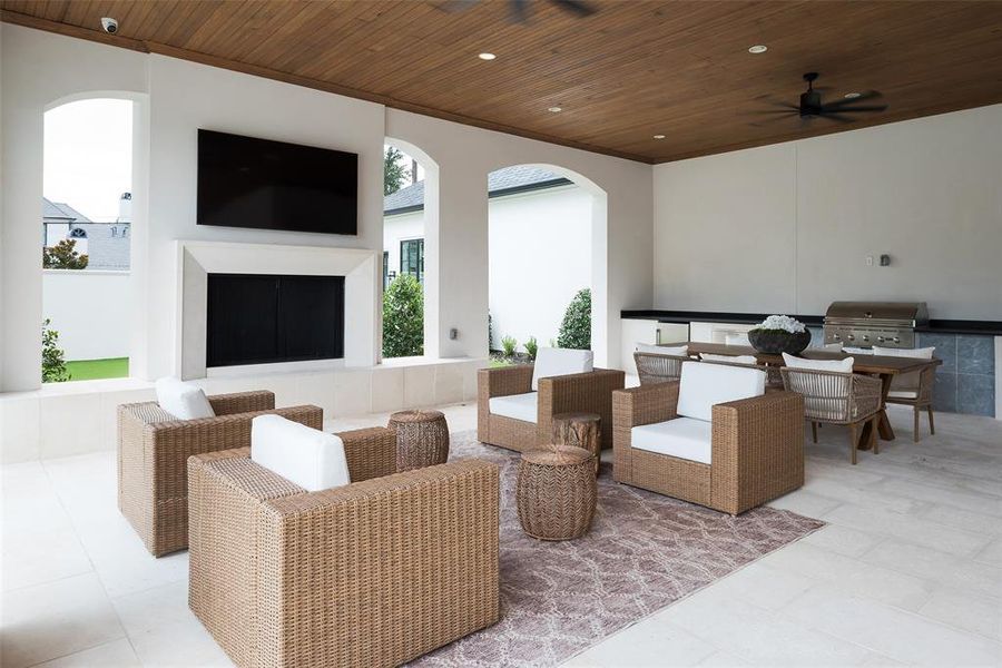 View of patio / terrace with area for grilling, outdoor lounge area, and ceiling fan