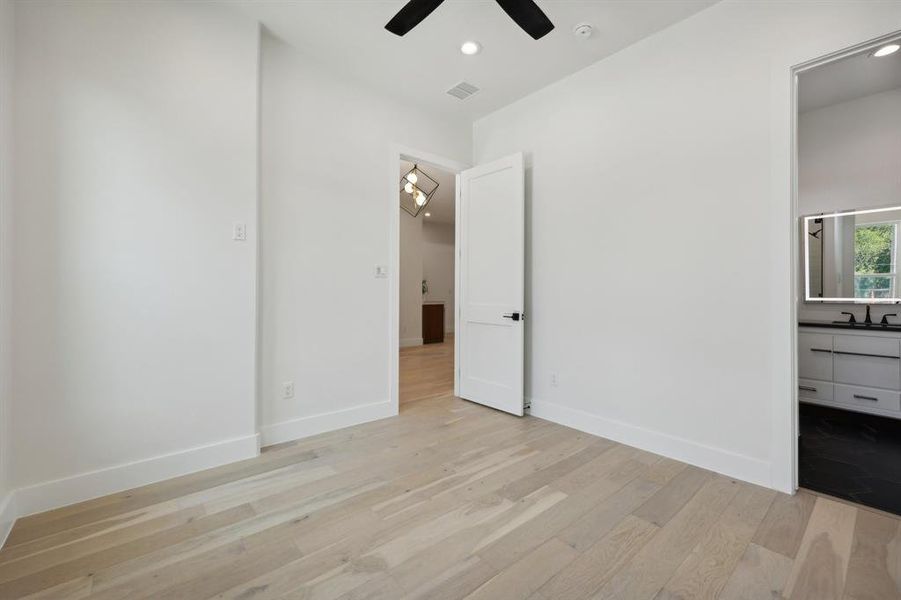 Unfurnished bedroom featuring light hardwood / wood-style floors and ceiling fan