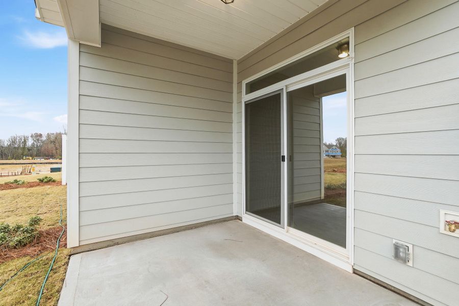 Exterior details and patio area of a home in Blythe Mill Townhomes, Waxhaw (Image 18).