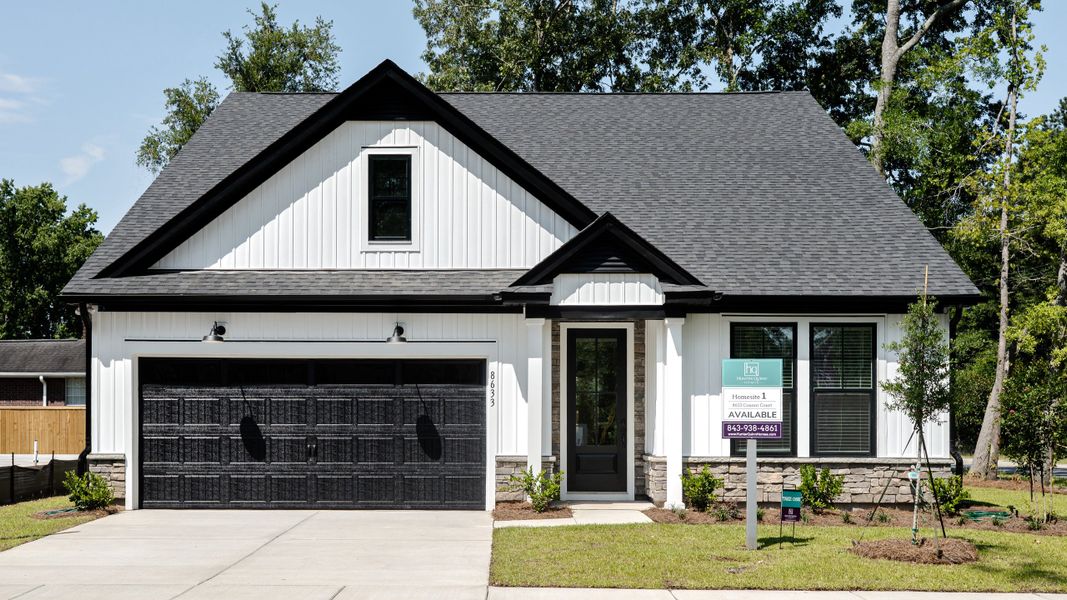 Front exterior of a new home in Huckleberry Estates, Conway, SC, highlighting curb appeal (Image 1).