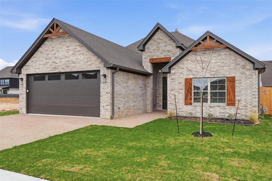 Front exterior of a new home in , Woodway, TX, highlighting curb appeal (Image 2). Front exterior of a new home in , Woodway, TX, highlighting curb appeal (Image 2).