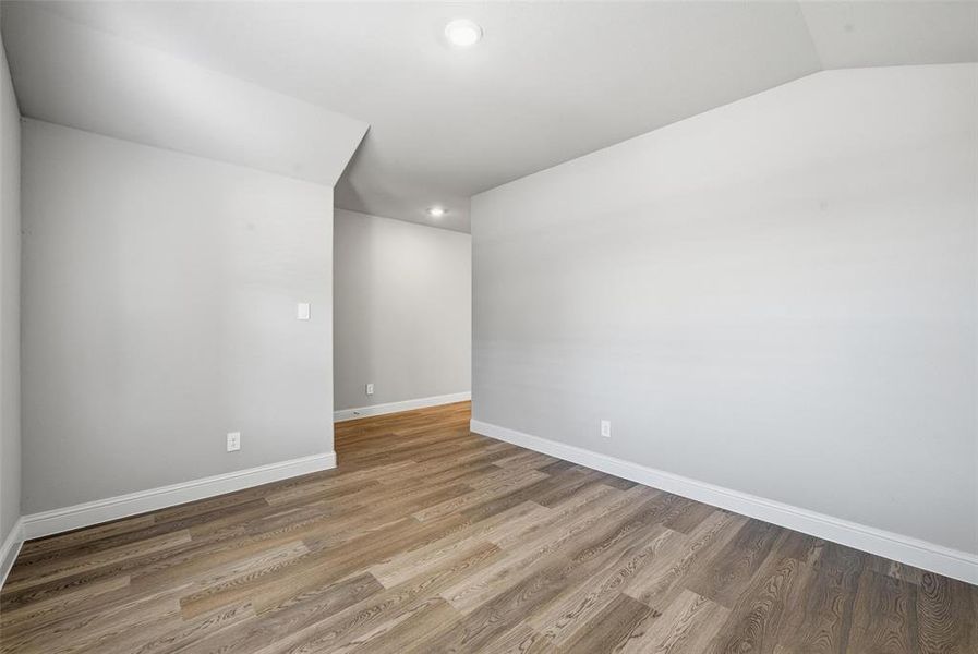 Unfurnished room featuring light wood-style flooring and recessed lighting