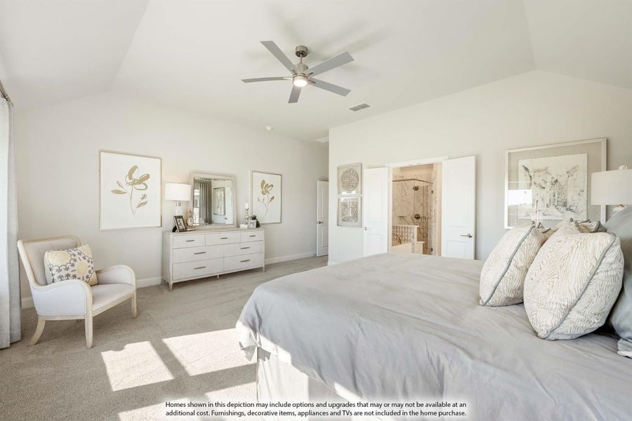 Master bedroom with vaulted ceiling, ceiling fan, carpet flooring, and ensuite bathroom access
