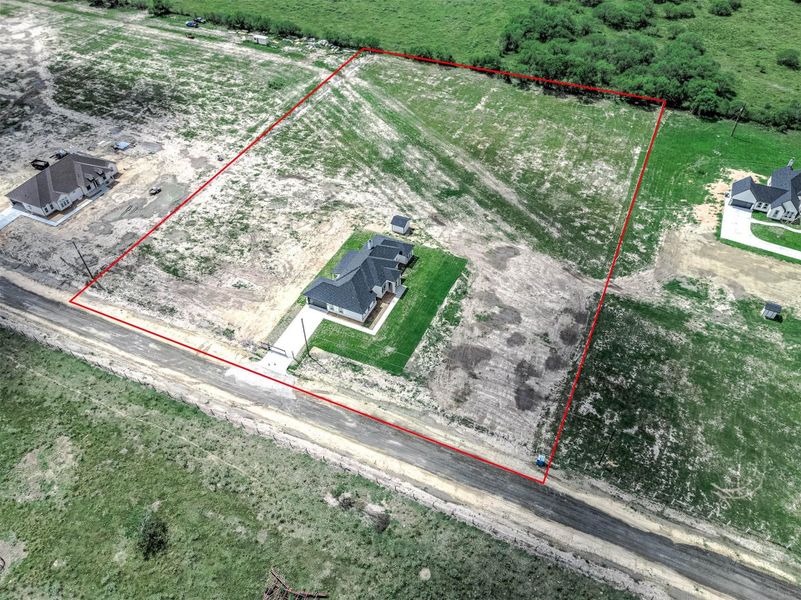 Aerial view of the property, with the red outline showing the property boundaries and surrounding land. Aerial view of the property, with the red outline showing the property boundaries and surrounding land.