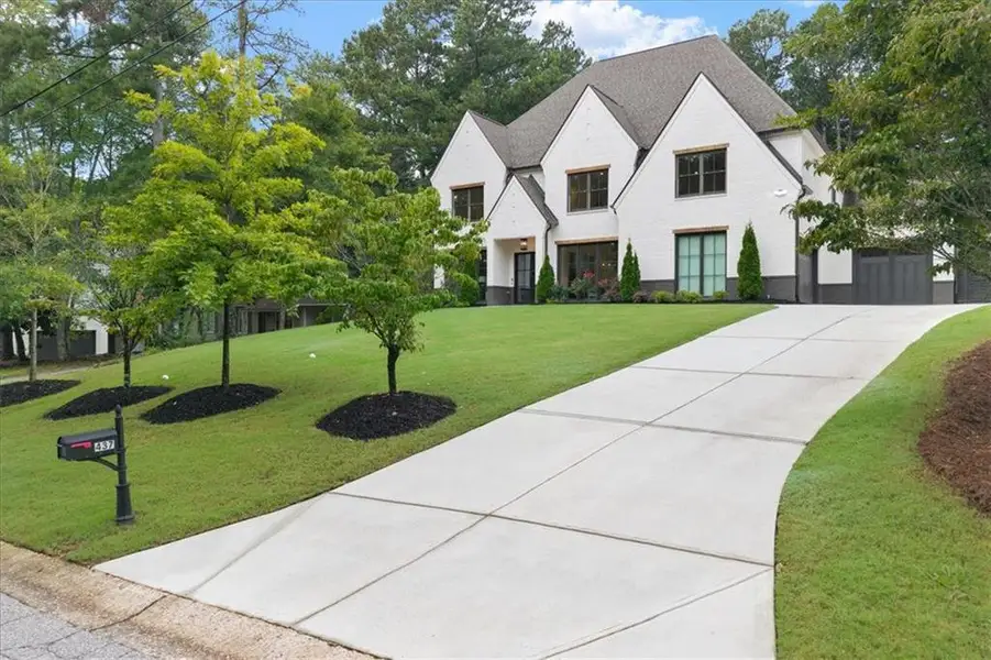 Front exterior of a new home in , Alpharetta, GA, highlighting curb appeal (Image 1). Front exterior of a new home in , Alpharetta, GA, highlighting curb appeal (Image 1).