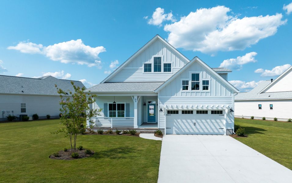 Representative exterior photo of a completed home built from the Kauai by Bill Clark Homes in Osprey Landing, Southport, NC (Image 31). Representative exterior photo of a completed home built from the Kauai by Bill Clark Homes in Osprey Landing, Southport, NC (Image 31).