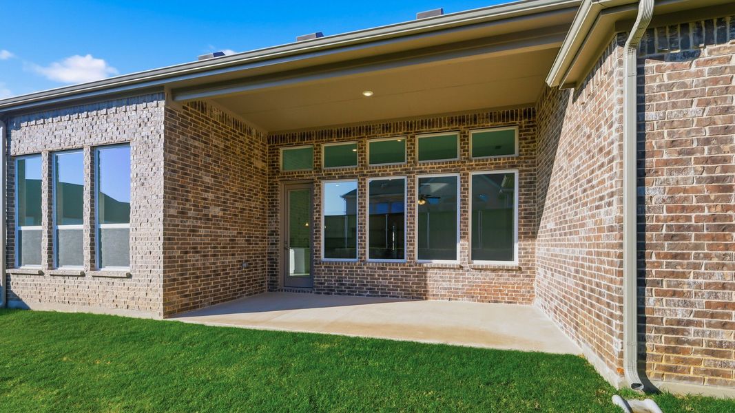 Exterior details and patio area of a home in Rio Vista at Kelly Ranch, Aledo (Image 22).