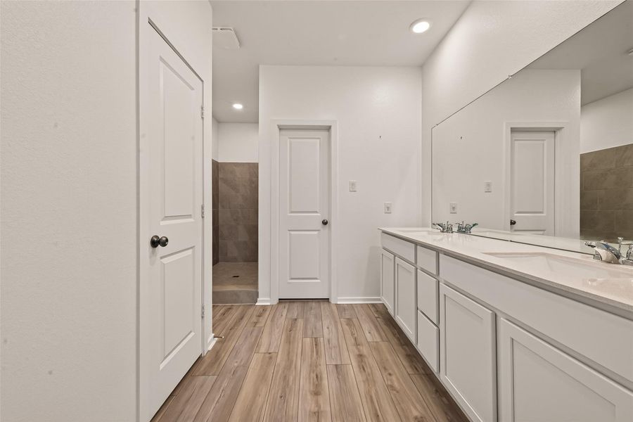 Furnished interior view inside a new home in Sunterra, Katy (Image 11).