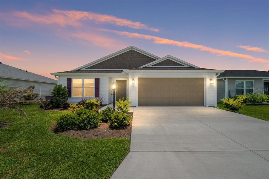Front exterior of a new home in , The Villages, FL, highlighting curb appeal (Image 19).