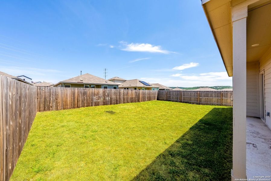 Front exterior of a new home in , Bulverde, TX, highlighting curb appeal (Image 26).