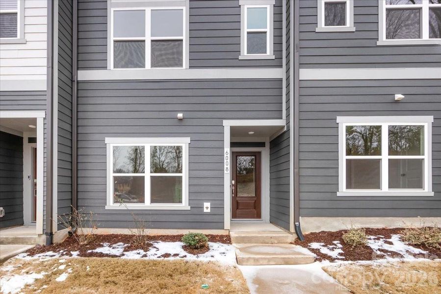 Exterior details and patio area of a home in Context at Oakhurst, Charlotte (Image 20).