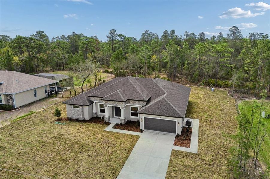Front exterior of a new home in , Weeki Wachee, FL, highlighting curb appeal (Image 31). Front exterior of a new home in , Weeki Wachee, FL, highlighting curb appeal (Image 31).
